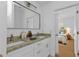 Double vanity bathroom with granite countertop and a modern design at 24083 Buckingham Way, Port Charlotte, FL 33980