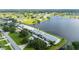 Aerial view of condo building near lake; desirable waterfront location at 1512 Rio De Janeiro Ave # 327, Punta Gorda, FL 33983