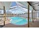 Relaxing kidney-shaped pool with screened enclosure at 156 Morgan Se Ln, Port Charlotte, FL 33952