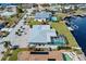 Aerial view showcasing canal-front home and pool at 156 Morgan Se Ln, Port Charlotte, FL 33952