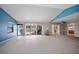Spacious living area with high ceilings and sliding doors to the pool at 156 Morgan Se Ln, Port Charlotte, FL 33952