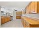 Long kitchen with lots of cabinets and countertop space at 156 Morgan Se Ln, Port Charlotte, FL 33952