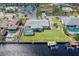 Aerial view of canal-front home with large yard at 156 Morgan Se Ln, Port Charlotte, FL 33952