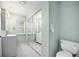 Bathroom with double vanity, toilet, and mirrored closet at 156 Morgan Se Ln, Port Charlotte, FL 33952