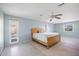 Bright bedroom with light walls, ceiling fan, and wood-framed bed at 156 Morgan Se Ln, Port Charlotte, FL 33952
