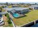 Aerial view of a home with a pool and backyard at 156 Morgan Se Ln, Port Charlotte, FL 33952
