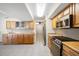 Spacious kitchen with wood cabinets, stainless steel appliances, and tile flooring at 156 Morgan Se Ln, Port Charlotte, FL 33952