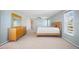 Main bedroom with wood dresser and light walls at 156 Morgan Se Ln, Port Charlotte, FL 33952