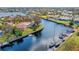 Aerial view showcasing home's waterfront location and canal access at 156 Morgan Se Ln, Port Charlotte, FL 33952