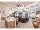 Two story living room with high ceilings, fireplace, and open kitchen at 1209 San Mateo Dr, Punta Gorda, FL 33950