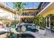 Beautiful pool area with tropical landscaping and statuary at 1209 San Mateo Dr, Punta Gorda, FL 33950