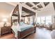 Spacious main bedroom with a four-poster bed and sitting area at 1209 San Mateo Dr, Punta Gorda, FL 33950
