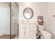 Clean bathroom with walk-in shower and white vanity at 1209 San Mateo Dr, Punta Gorda, FL 33950