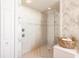 Walk-in shower with glass enclosure and tiled walls at 1209 San Mateo Dr, Punta Gorda, FL 33950
