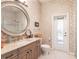 Elegant bathroom with patterned wallpaper and a walk-in shower at 1209 San Mateo Dr, Punta Gorda, FL 33950