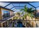 View of a luxurious pool and surrounding landscaping from above at 1209 San Mateo Dr, Punta Gorda, FL 33950