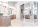 Large bathroom with double vanities, a soaking tub, and a walk-in shower at 1209 San Mateo Dr, Punta Gorda, FL 33950