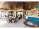 Relaxing outdoor patio with seating, bar, and views to the pool at 1209 San Mateo Dr, Punta Gorda, FL 33950