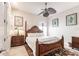 Guest bedroom with a wooden bed frame and ceiling fan at 1209 San Mateo Dr, Punta Gorda, FL 33950