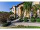 Grand two-story home with manicured landscaping and a paved walkway at 1209 San Mateo Dr, Punta Gorda, FL 33950