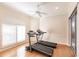 Bright home gym with two treadmills and hardwood floors at 1209 San Mateo Dr, Punta Gorda, FL 33950