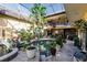 Private courtyard with a pool and lush plants at 1209 San Mateo Dr, Punta Gorda, FL 33950