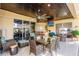 Spacious covered patio with seating area, bar, and fire pit at 1209 San Mateo Dr, Punta Gorda, FL 33950