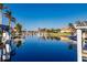 Peaceful waterfront view with boats and clear blue water at 1209 San Mateo Dr, Punta Gorda, FL 33950