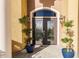 Double front doors with glass accents, flanked by potted plants at 1209 San Mateo Dr, Punta Gorda, FL 33950