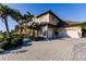 Two story home with large driveway and lush landscaping at 1209 San Mateo Dr, Punta Gorda, FL 33950