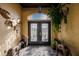 Bright entryway with decorative accents and double doors at 1209 San Mateo Dr, Punta Gorda, FL 33950