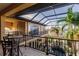 Overlooking a tranquil pool area with a screened enclosure at 1209 San Mateo Dr, Punta Gorda, FL 33950