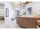 Spa-like bathroom with double vanities, a shower, and a large mirror at 1209 San Mateo Dr, Punta Gorda, FL 33950