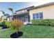 Landscaped backyard showcasing the home's exterior at 1209 San Mateo Dr, Punta Gorda, FL 33950