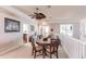 Upstairs dining area with table and chairs, next to a sitting area at 1209 San Mateo Dr, Punta Gorda, FL 33950
