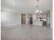 Open concept dining area with tile floor and view of kitchen at 16024 Crofton Springs Way, Port Charlotte, FL 33953