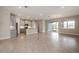 Open concept kitchen with island, stainless steel appliances, and granite countertops at 16024 Crofton Springs Way, Port Charlotte, FL 33953