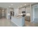 Modern kitchen with granite island and stainless steel appliances at 16024 Crofton Springs Way, Port Charlotte, FL 33953