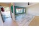 Bright living room with wood-look floors and a view to the front yard at 18939 Ayrshire Cir, Port Charlotte, FL 33948