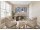 Cozy home office with natural light, neutral tones, and modern furnishings for a productive workspace at 25228 Rampart Blvd, Punta Gorda, FL 33983