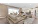 Open concept living area flows into the kitchen with modern island, and stainless appliances at 25228 Rampart Blvd, Punta Gorda, FL 33983