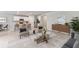 Open concept living area featuring a kitchen with bar seating and stylish furnishings at 25236 Rampart Blvd, Punta Gorda, FL 33983