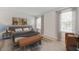 Inviting main bedroom with soft natural light, neutral colors, and comfortable furnishings at 25236 Rampart Blvd, Punta Gorda, FL 33983