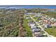 View of a neighborhood with green spaces near a scenic body of water at 4255 Oak Terrace Cir, Port Charlotte, FL 33953