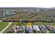 An aerial view of a charming neighborhood with well-maintained lawns and beautiful landscaping at 4255 Oak Terrace Cir, Port Charlotte, FL 33953