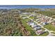A neighborhood sits close to a lake surrounded by lush greenery at 4255 Oak Terrace Cir, Port Charlotte, FL 33953