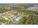 Panoramic aerial view of a tranquil community with picturesque lakes and verdant landscapes at 4255 Oak Terrace Cir, Port Charlotte, FL 33953