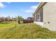 Spacious backyard featuring lawn and screened-in patio at 4255 Oak Terrace Cir, Port Charlotte, FL 33953