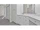 Modern bathroom with a granite countertop vanity, cabinet and an ensuite bathroom at 4255 Oak Terrace Cir, Port Charlotte, FL 33953