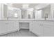 Modern bathroom featuring a spacious vanity with ample lighting at 4255 Oak Terrace Cir, Port Charlotte, FL 33953